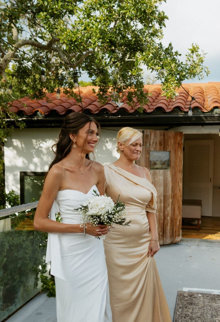 mom walking bride down the aisle