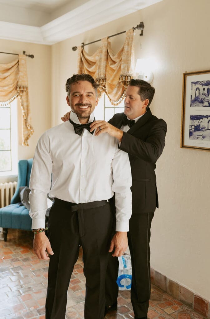 groom getting ready with dad