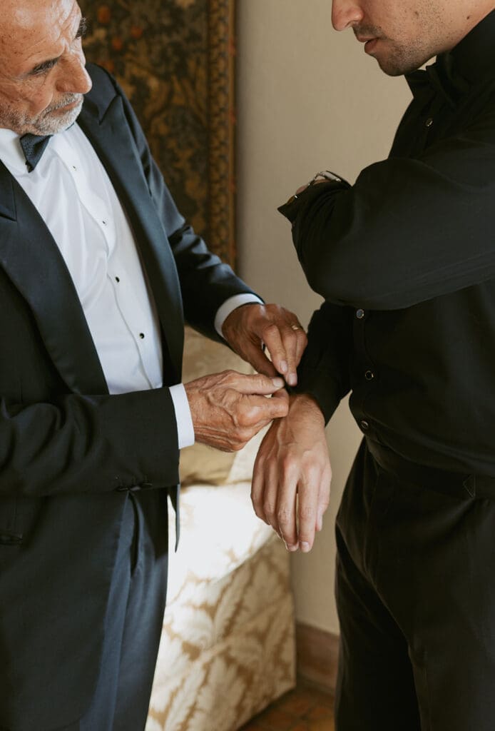 groom getting ready with dad