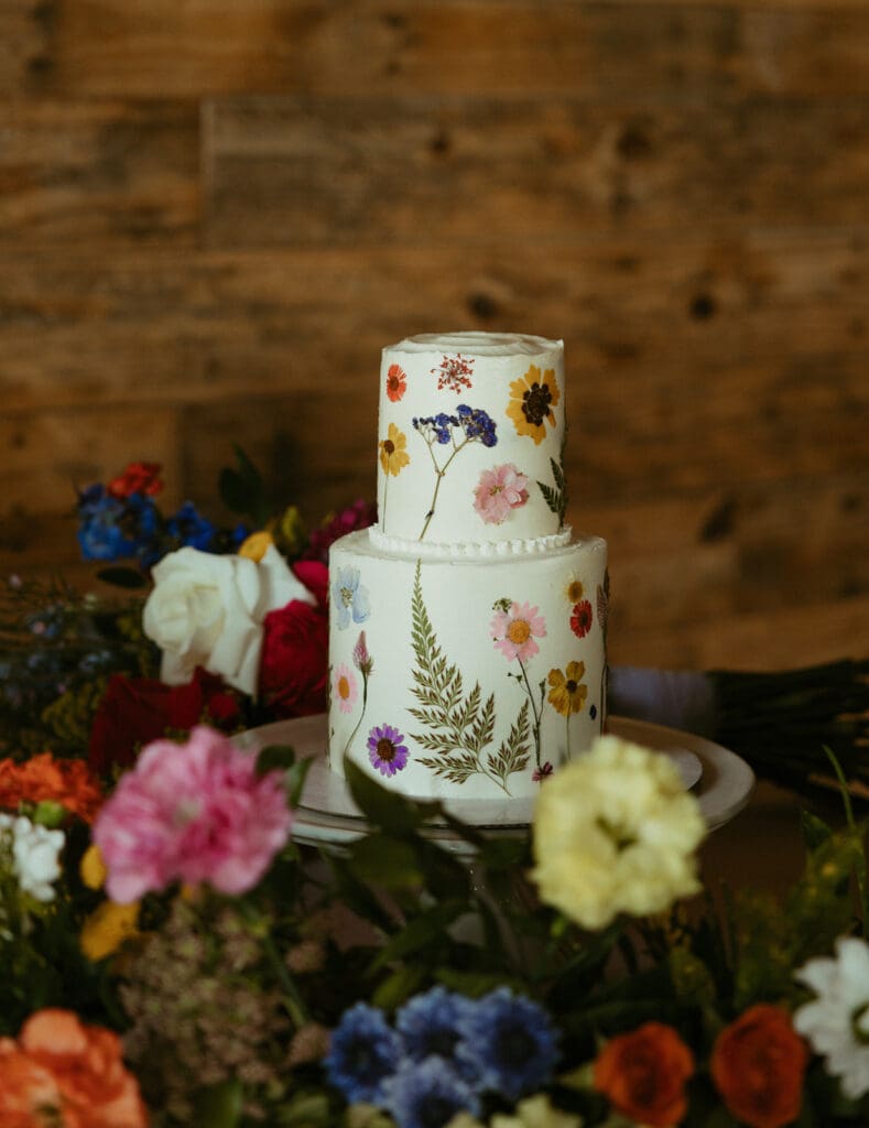 wildflower theme two tiered wedding cake