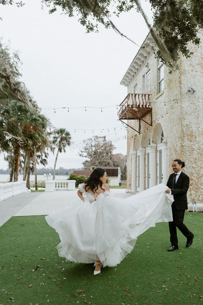 bride and groom in front of the european inspired bella cosa wedding venue