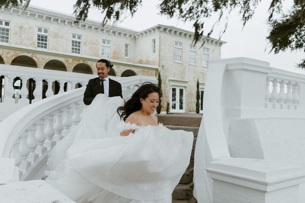 bride and groom in front of the bella cosa wedding venue