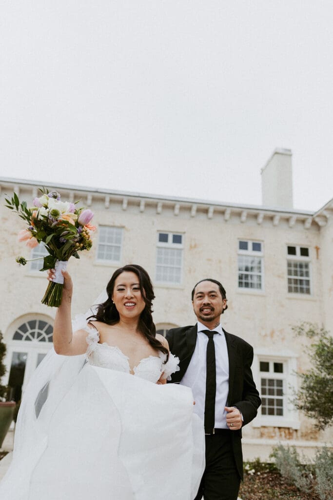 sweet couple in front of the bella cosa wedding venue in florida