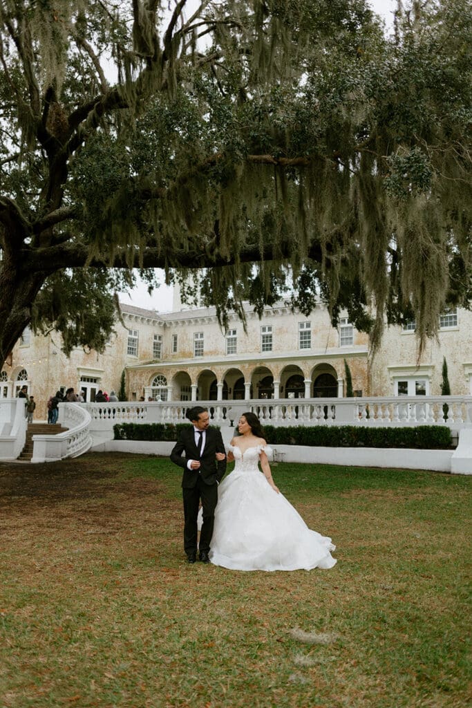 playful couple in front of bella cosa 