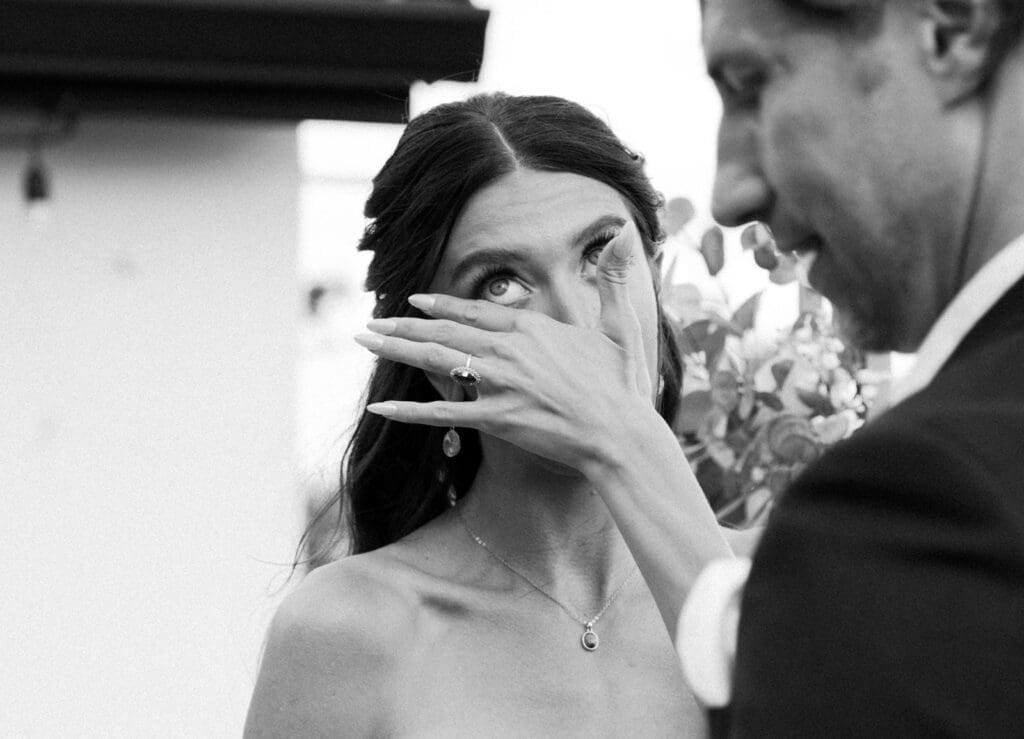 candid elopement ceremony on a balcony overlooking water for a st augustine elopement
