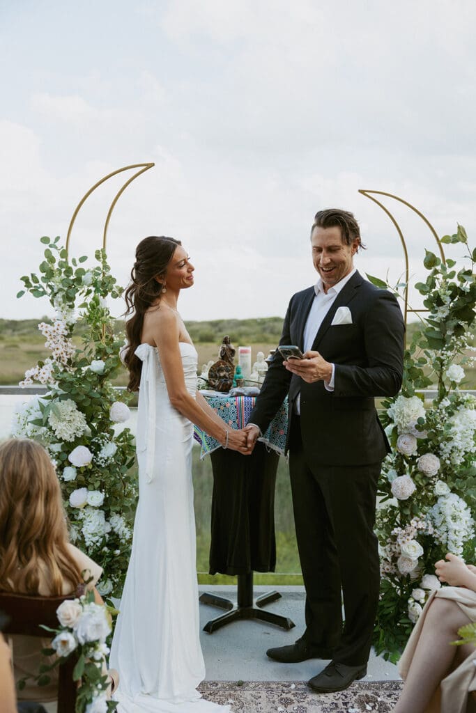 candid elopement ceremony on a balcony overlooking water for a st augustine elopement