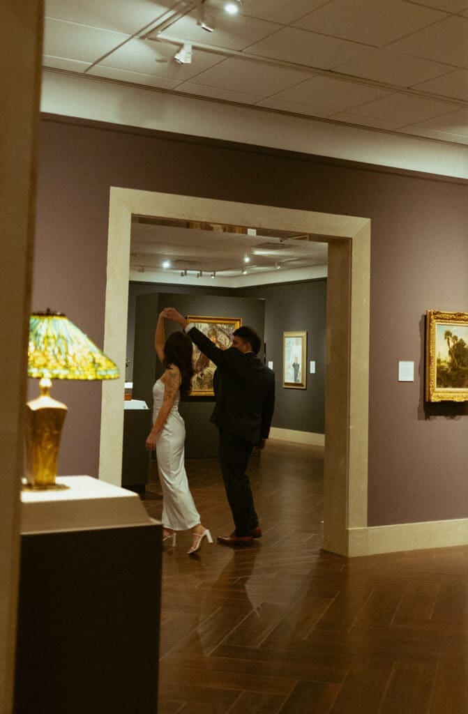 elegant, playful couple at the art museum