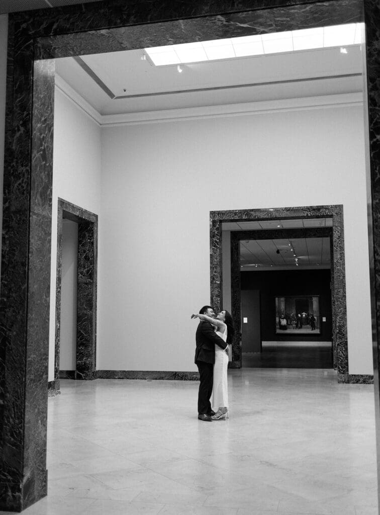elegant, playful couple at the art museum