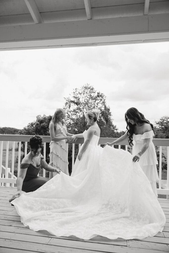 bride and bridesmaid on the balcony at uliana estate