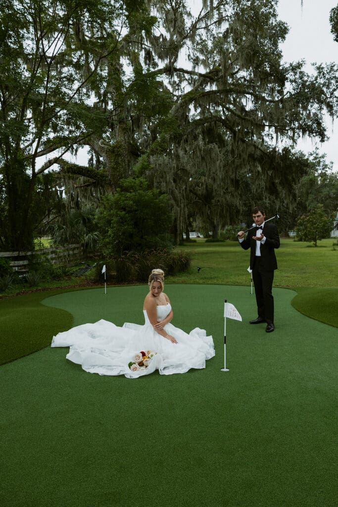 bride and groom posing at the golf course at uliana estate
