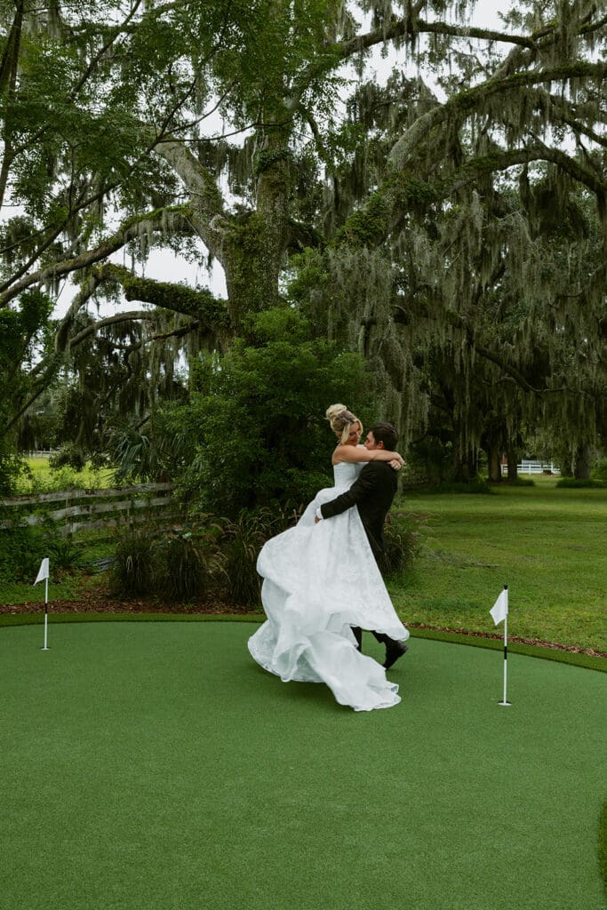 bride and groom twirling at the golf course at uliana estate