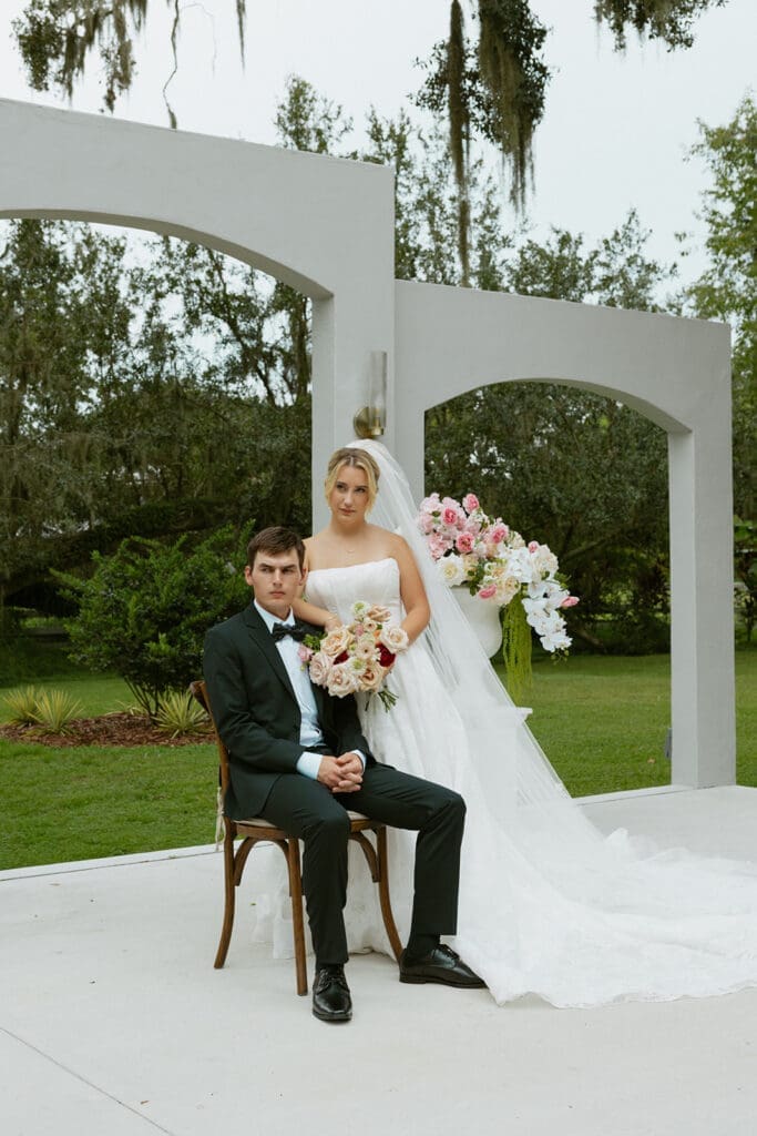 bride and groom posing at the ceremony site at uliana estate
