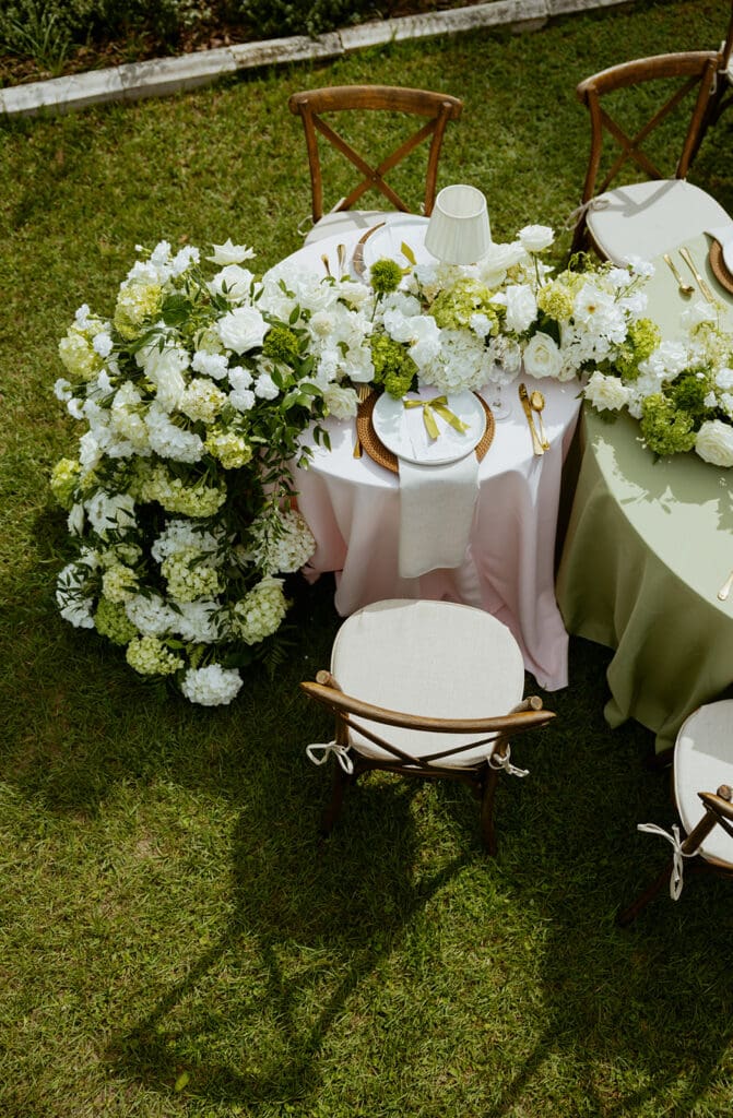 uliana estate outdoor reception space, tables decorated with pastel linens and white floral runners