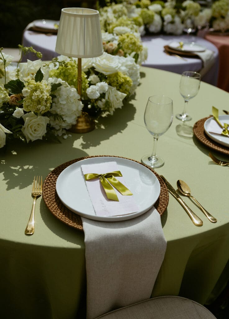uliana estate outdoor reception space, tables decorated with pastel linens and white floral runners